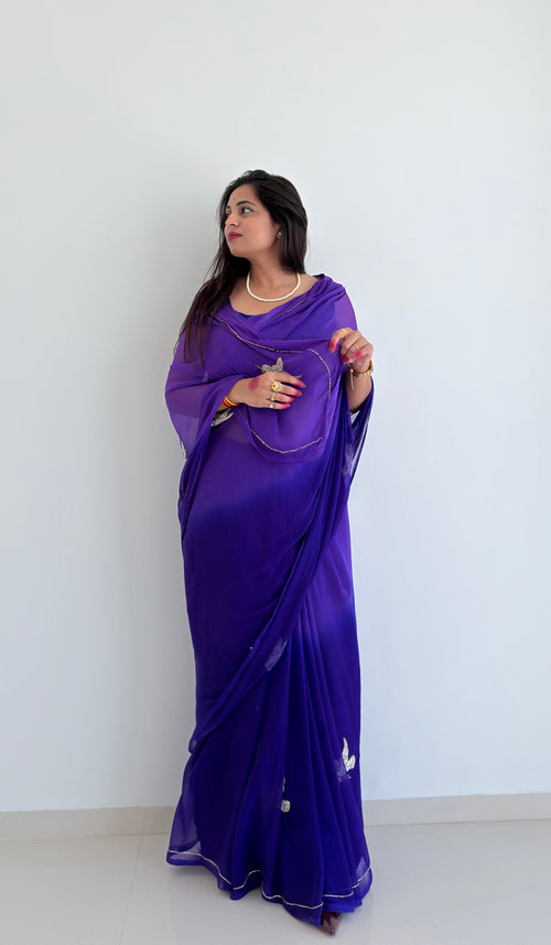 An exquisite purple chiffon saree with intricate bird embroidery, designed to add effortless elegance to your wardrobe
